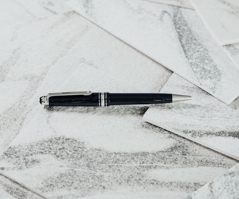 Pen resting on legal papers